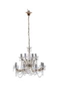 A pair of Continental moulded and cut glass and metal framed twelve light chandeliers