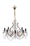 A Continental gilt metal and moulded glass eight light chandelier