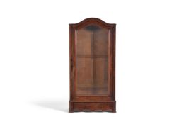 A walnut display cabinet with arched top and single glazed door above a waved base with squared feet