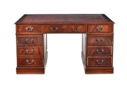 A modern reproduction mahogany twin pedestal desk