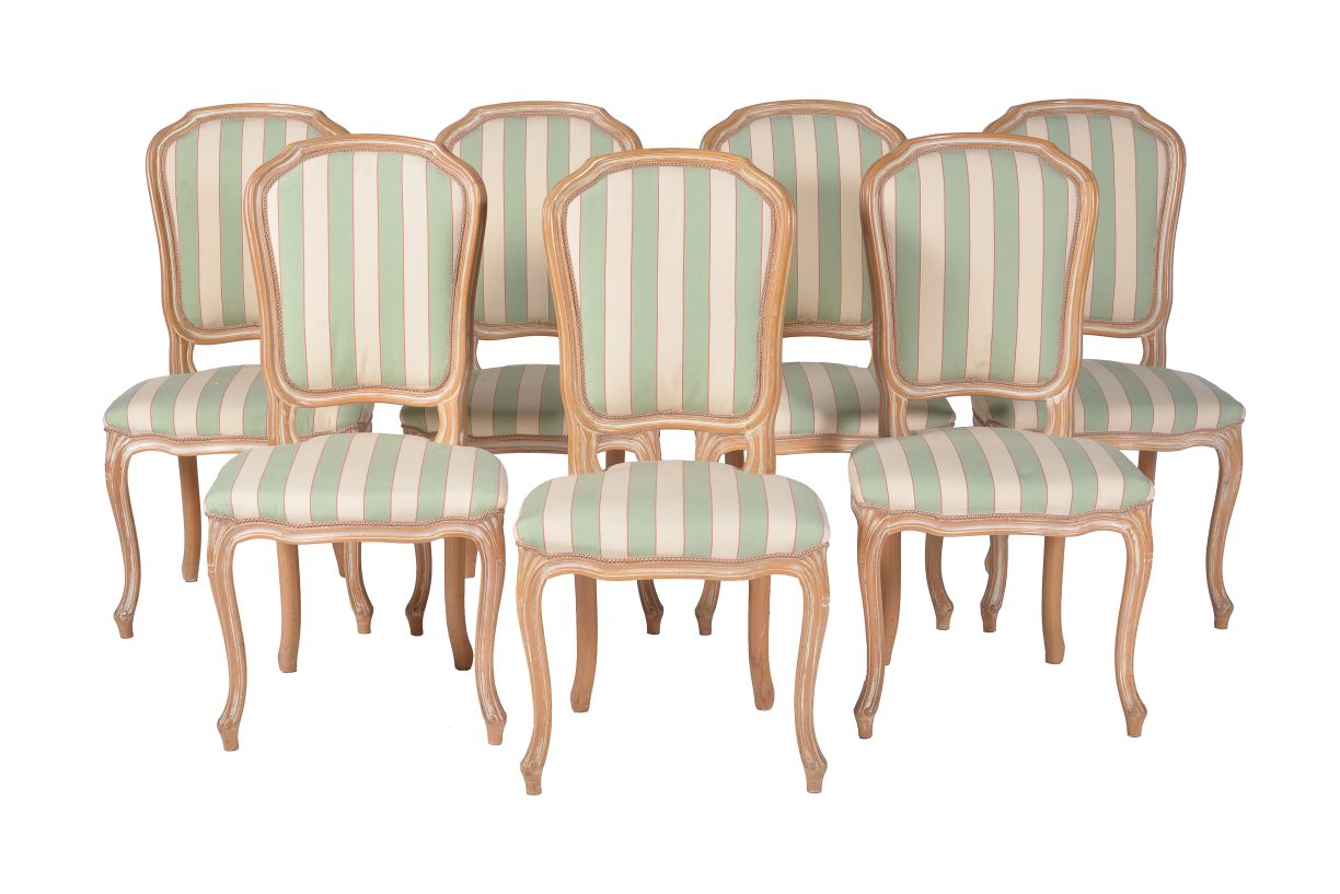 A set of seven modern limed beechwood dining chairs in Louis XV style