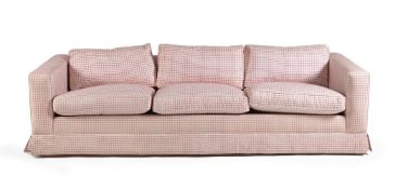 A pink square checked upholstered three seater sofa