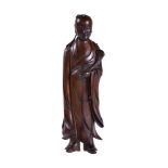 A Chinese carved boxwood figure of a scholar