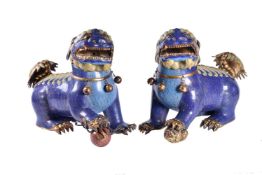 A large pair of cloisonné enamel Buddhist lions