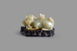 A Chinese yellow jade 'Mythical Beast' cover and stand