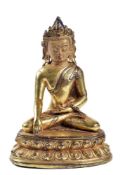 A gilt-bronze figure of Sakyamuni Buddha