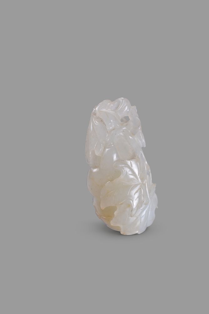 A Chinese white jade and russet 'Double gourd' pendant