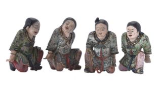 A set of four Chinese painted wood figures