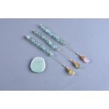 A group of three strings of aquamarine beads for a court necklace