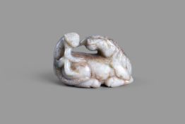 A Chinese jade carving of a horse and monkey