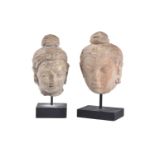 Two stucco heads of Buddha