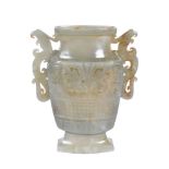 A Chinese celadon and russet jade archaistic vase