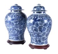 A pair of Chinese blue and white baluster jars with covers
