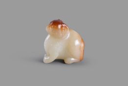 A white and russet jade carving of a mythical beast