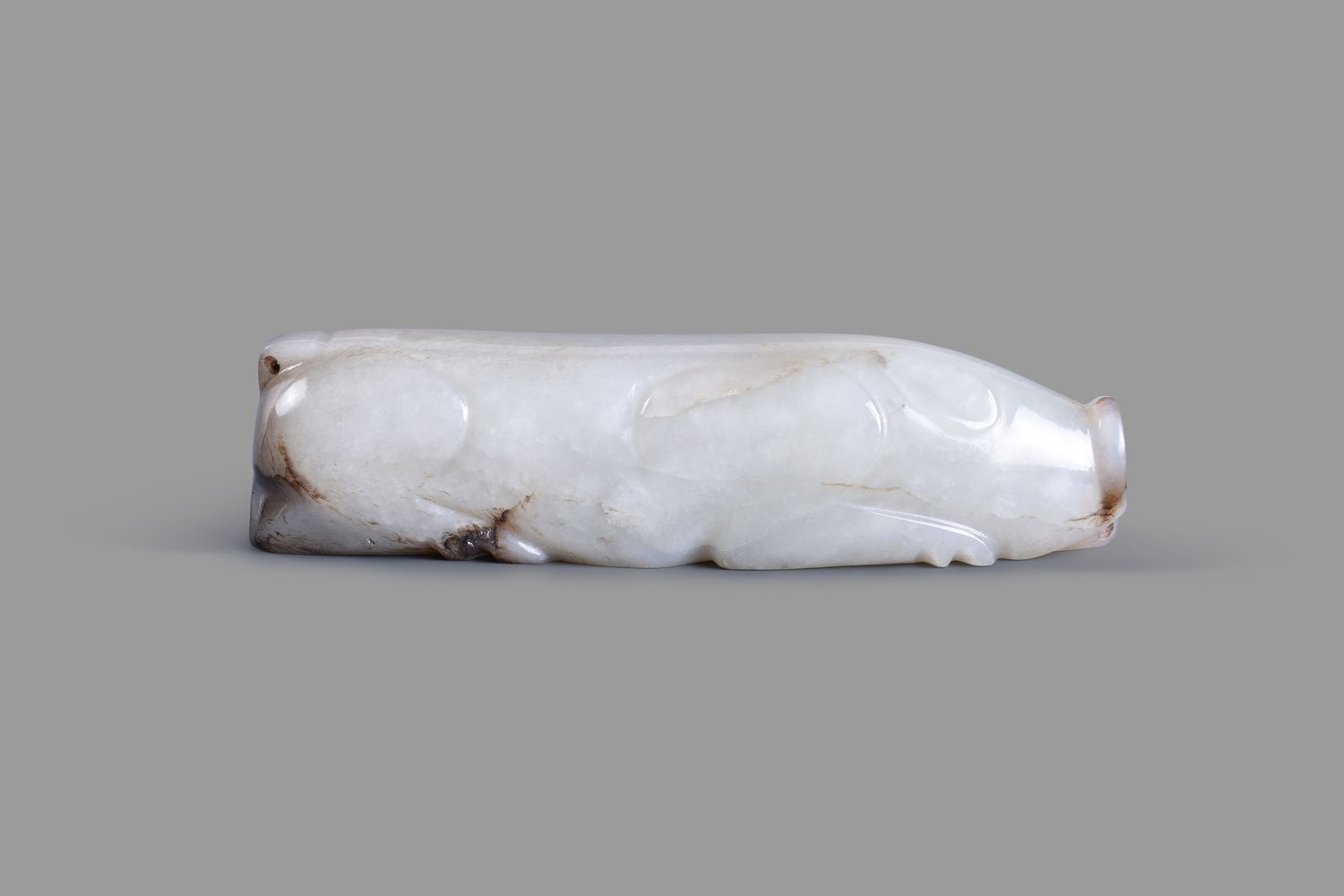 A Chinese pale and grey jade carving of a pig