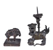 A bronze ‘Shishi’ candlestick