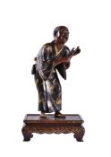 Miya-O Eisuke: A Japanese Parcel Gilt Bronze Figure of a Singer
