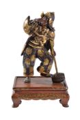 Miya-o Eisuke: A Parcel Gilt Bronze Figure of a man wearing elaborately decorated clothes and a kabu