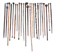 A large group of thirty-three wood Tribal Canes