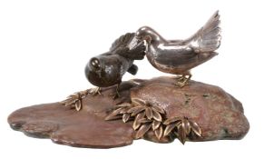 A Japanese Group of Two Fantail Doves on a rocky outcrop by a stream