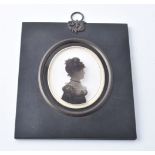 Arthur Lea (1768-1828)Portrait of a ladySilhouette painted on curved glass with verre églomisé borde