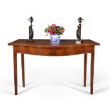 A George III mahogany serpentine fronted serving table, circa 1780