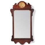 A George II walnut and parcel gilt wall mirror, circa 1750