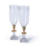 A pair of late George III or Regency cut and engraved glass and gilt metal mounted storm lanterns, e