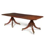 A mahogany triple pedestal extending dining table, circa 1800 and later