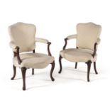 † A pair of George III mahogany armchairs, circa 1780