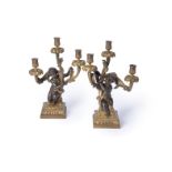 A pair of fine gilt and patinated bronze three light figural candelabra in late Louis XV taste, by H