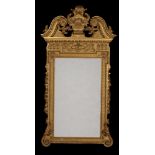 A carved giltwood wall mirror, in George II Palladian style, late 19th/early 20th century