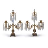 A pair of George IV gilt and patinated bronze and cut glass mounted twin light lustre candelabra, ci