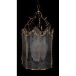 A substantial gilt metal and glazed hall lantern in Louis XV taste