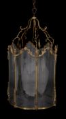 A substantial gilt metal and glazed hall lantern in Louis XV taste