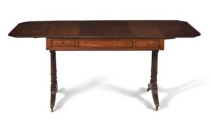 † A Regency plum pudding mahogany sofa games table, circa 1815