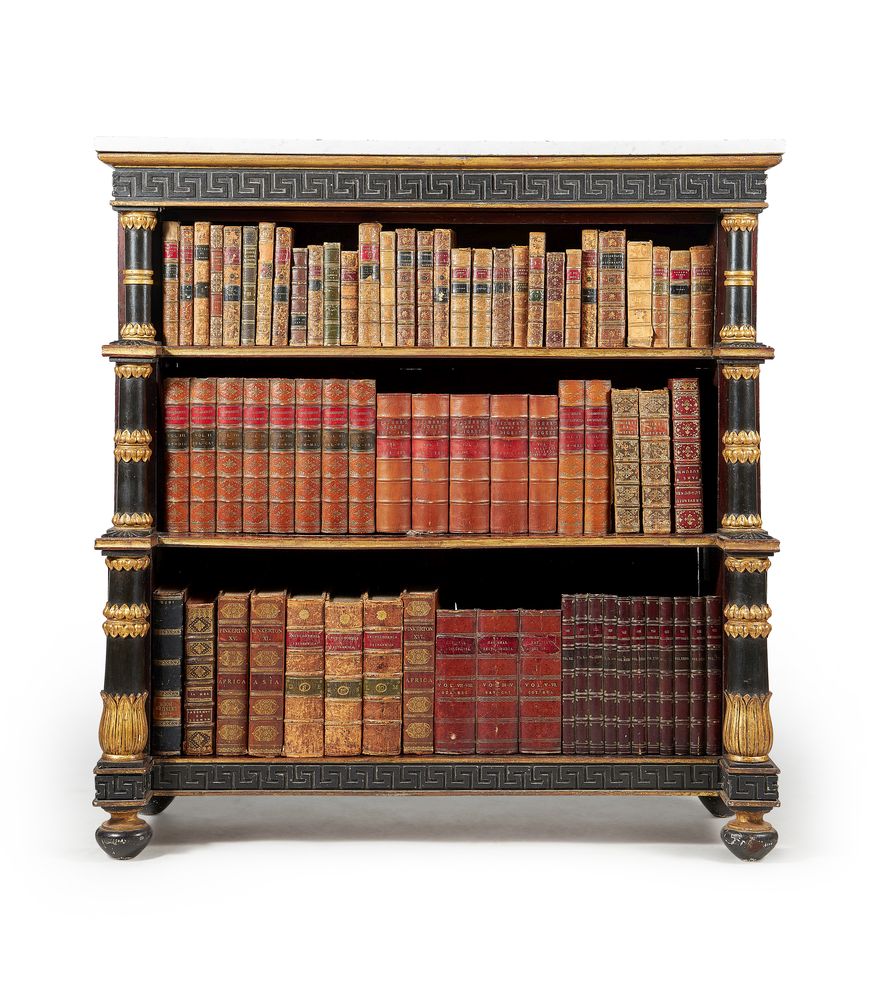 A Regency mahogany, ebonised and parcel gilt open ‘waterfall’ bookcase, circa 1815