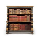 A Regency mahogany, ebonised and parcel gilt open ‘waterfall’ bookcase, circa 1815