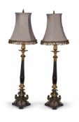 A pair of patinated and parcel gilt metal columnar table lamps in the manner of Louis Philippe candl