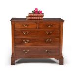 A George III mahogany and crossbanded chest of drawers, circa 1780