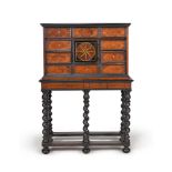 ϒ A Flemish walnut, ebonised and ivory inlaid cabinet on stand, possibly Antwerp