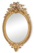 A French giltwood and composition oval wall mirror, in Louis XVI style, second half 19th century