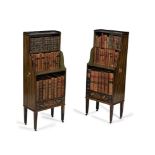 A pair of Regency ebonised and painted waterfall bookcases, circa 1815