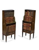 A pair of Regency ebonised and painted waterfall bookcases, circa 1815