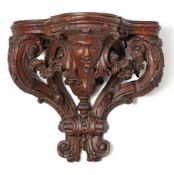 A George II carved oak wall bracket, circa 1735