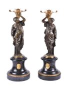 A pair of French gilt bronze and Noir Belge mounted figural candle holders in Orientalist taste, cir