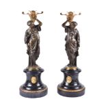 A pair of French gilt bronze and Noir Belge mounted figural candle holders in Orientalist taste, cir