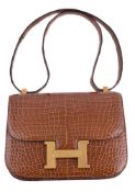ϒ Hermès, Constance, a brown crocodile handbag