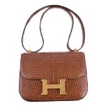 ϒ Hermès, Constance, a brown crocodile handbag