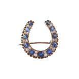 A late Victorian sapphire and diamond horseshoe brooch